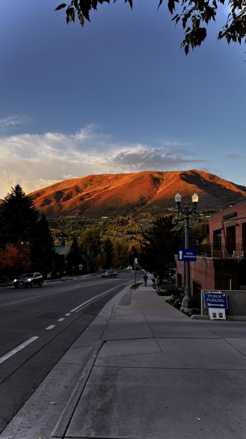 A sunset photo taken on North Mill Street in downtown Aspen on October 6th. In the distance, the colors of the trees change on Red Mountain.