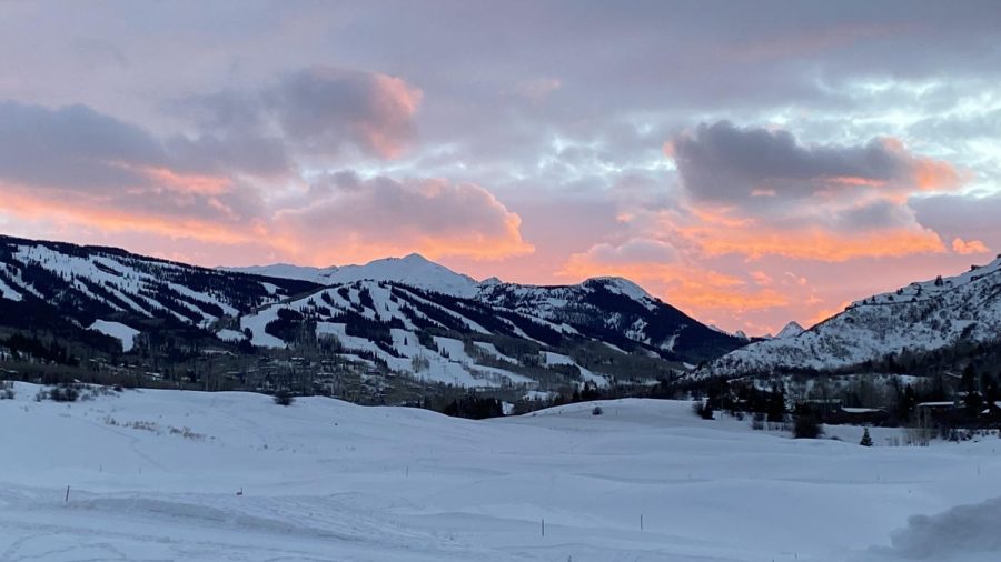 A photo that was taken in late November with beautiful sunset lighting up the Snowmass ski resort.