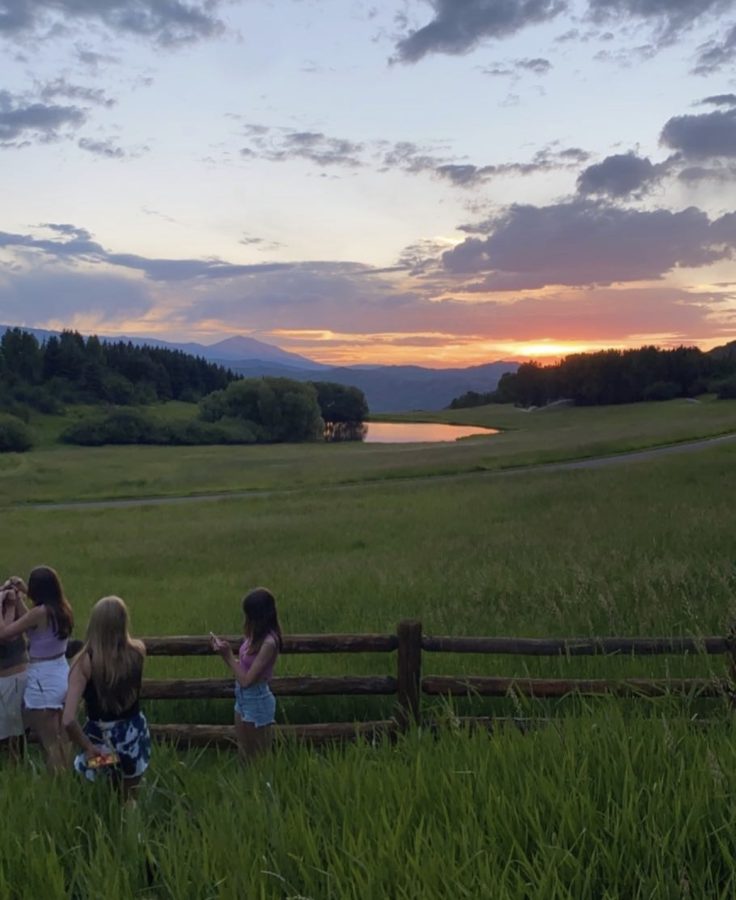 Students from Aspen High School watching the sunset during Summer of 2022
