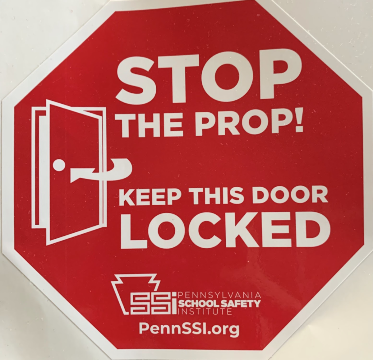 Sticker from Garrett Seddon telling people to “Stop The Prop”. These stickers will be found on doors that have been propped open to encourage students to stop leaving doors open.
