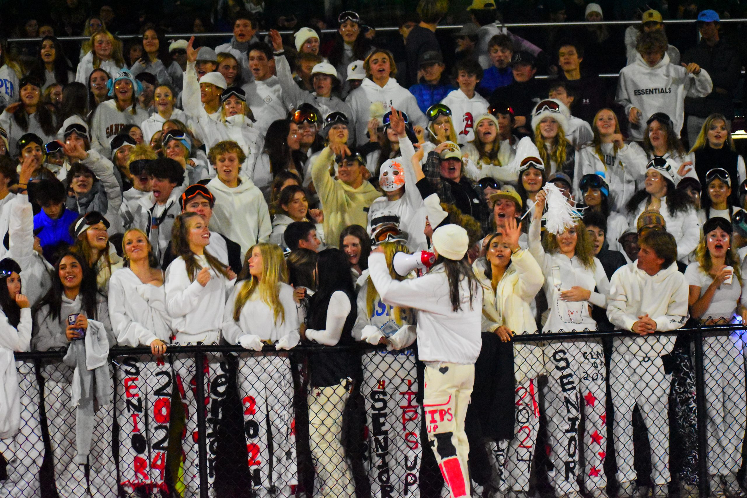 The student body gathers alongside one another to cheer with excitement at the 2023 homecoming football game, showcasing one of the many precious moments of high school.