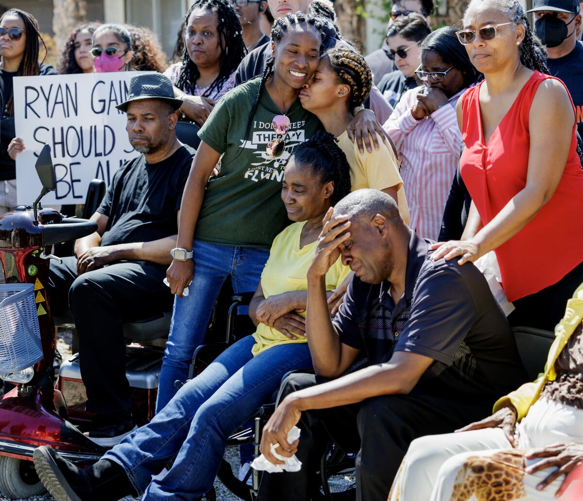 Family and community members attend a news conference after Ryan Gainers death.
