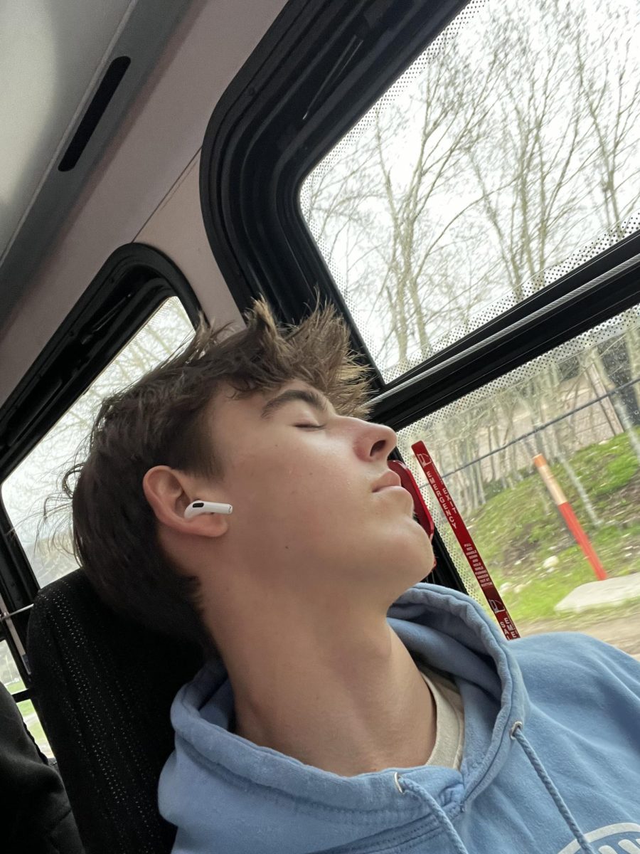 Aspen High School student Kieron Byford catches up on sleep during a school excursion.