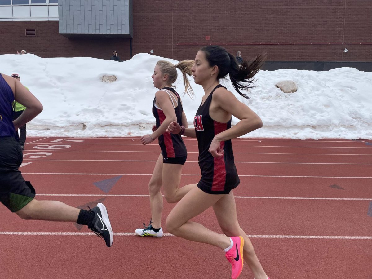 Freshman Avila Jennings and junior Julia Diaz run their way to the finish line on Aspen’s home track.

