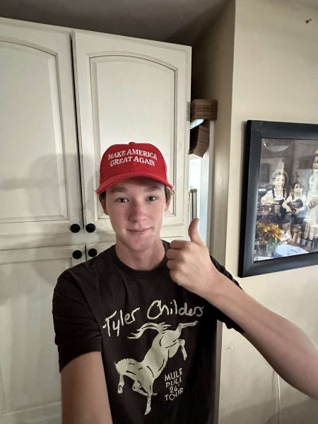 AHS Junior Chase Slesinger-Hall poses for a selfie with his Make America Great Again hat, showing support for Donald Trump in the upcoming 2024 Presidential Election.