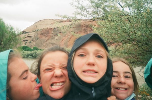 Current AHS seniors (from left to right) Lexi Munro, Luna Murray, Maeve Sheehan, and Kate Scott posing for a photo on their final days of eighth grade.