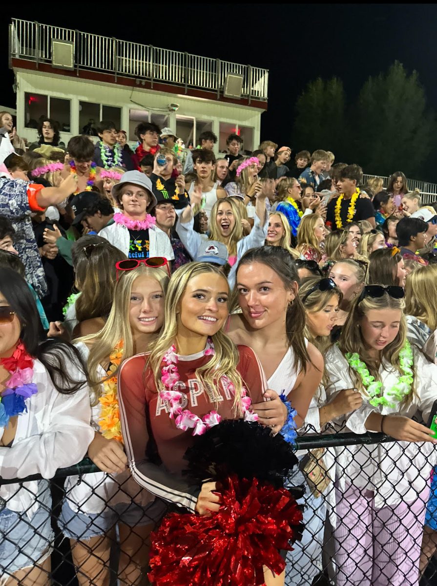 Sylvia Buck poses for her dance team senior night with two friends: Chloe Freeman (left) and Olivia Cook (right)