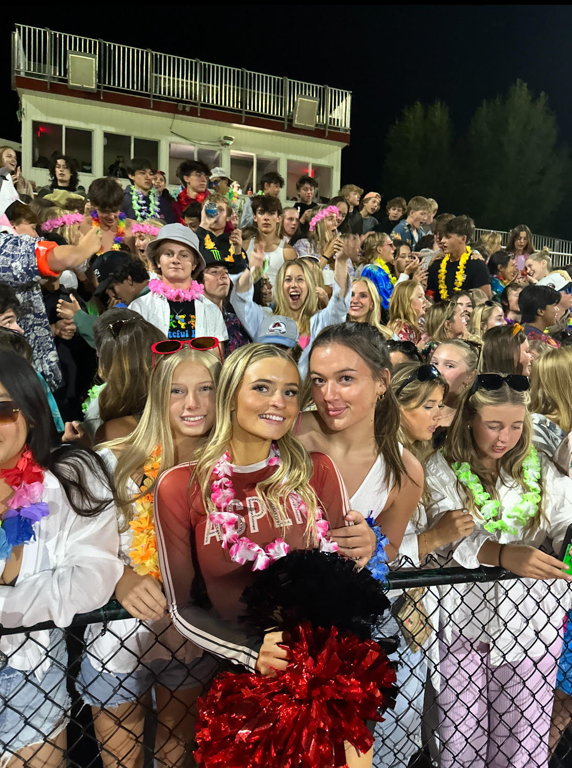 Sylvia Buck poses for her dance team senior night with two friends: Chloe Freeman (left) and Olivia Cook (right)