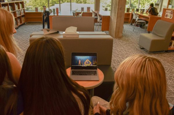 Devon Ryan, Zoe Owen, Whitney Mcmanus, and Emma Jane watch the beginning of K-Pop Demon Hunters in the AHS Library on Wednesday, Sept. 17, 2025. 