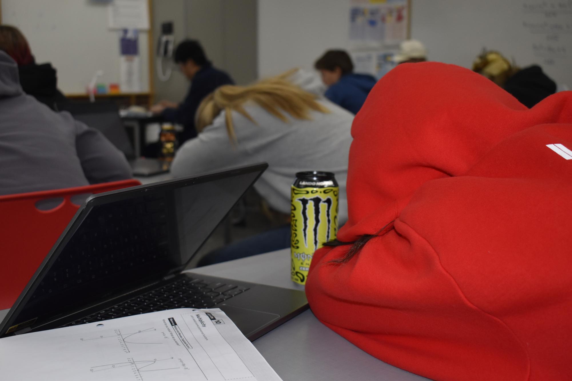 Captured at 8:10 AM in an Aspen High Classroom, this photo shows sophomore Olivia Wilson (in red) and Annie Strecker (in grey) asleep on their desks. 