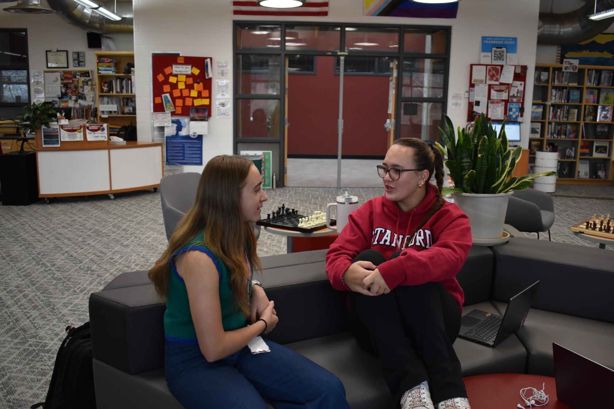 Two Students, Sloane Alexander and Zoe Owen have sit in the AHS Library and have a meaningful conversation. 
