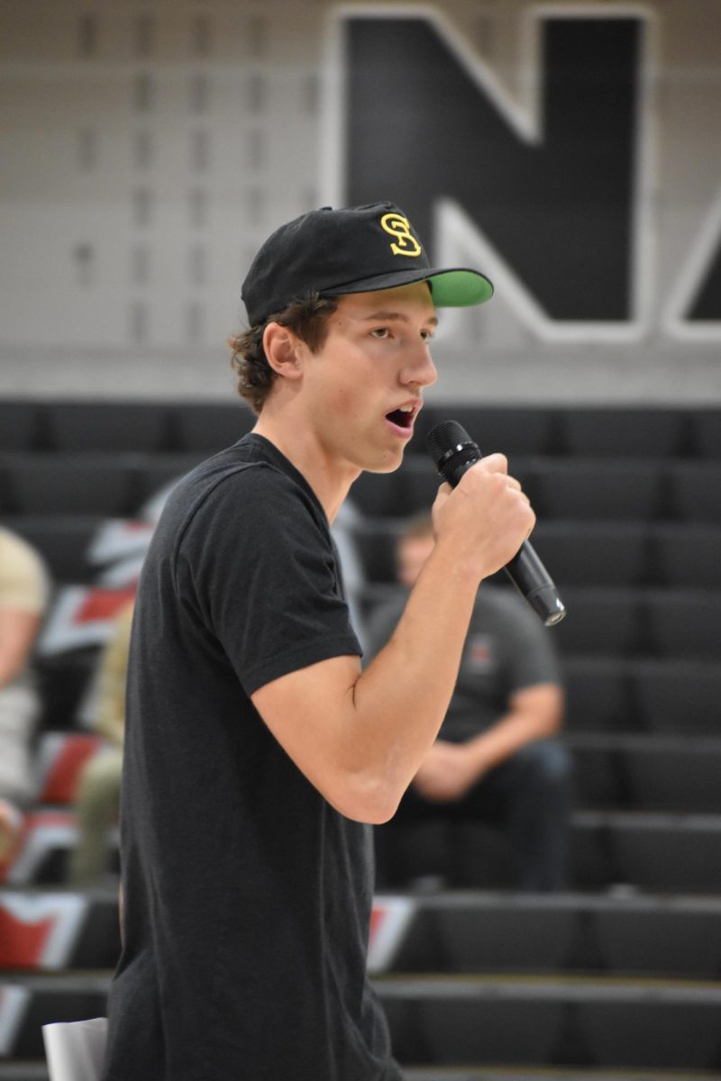 Co-head Cater Kuhlman hyping up the crowd at a AHS pep assembly. 