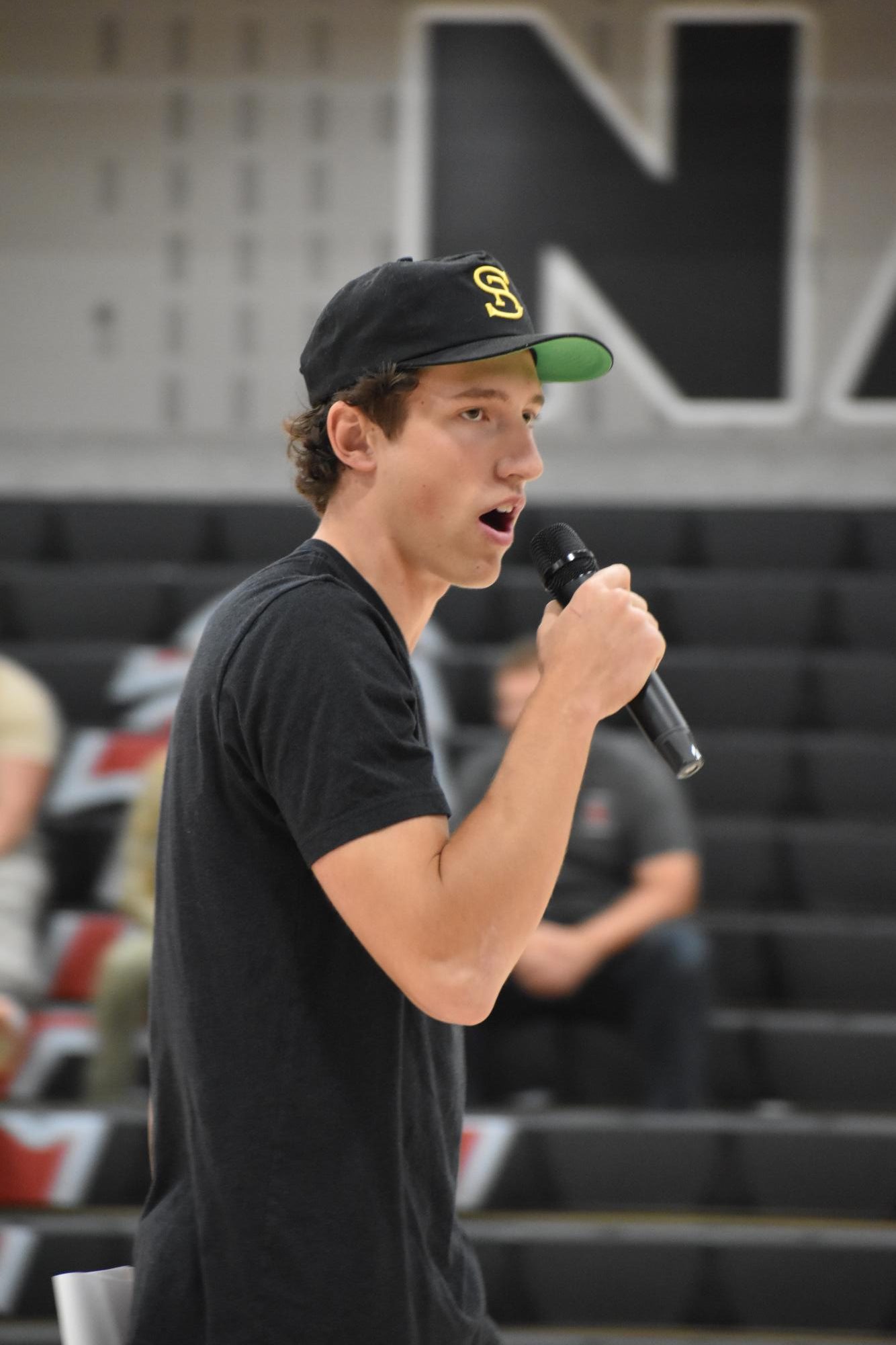 Co-head Cater Kuhlman hyping up the crowd at a AHS pep assembly. 