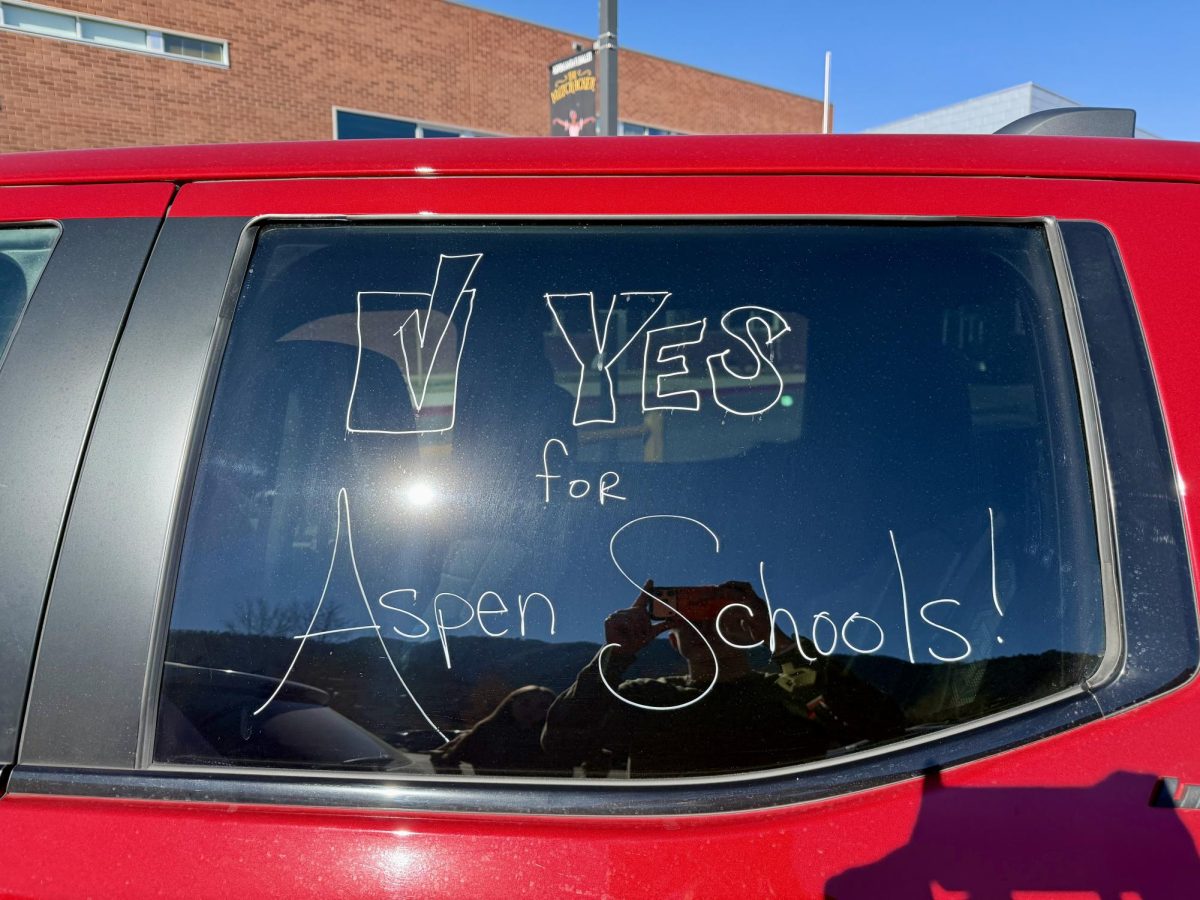 Community members in Aspen advertised ballot propositions on their cars, in person, and on signs near the roundabout.