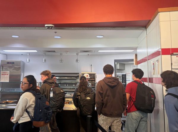 Students of all grade levels line up at the cafeteria, eager for the day's lunch. 