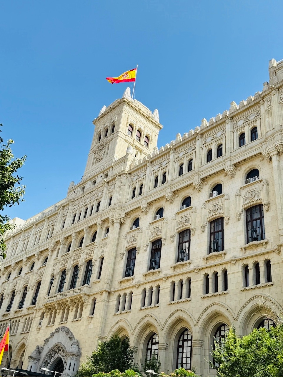 
This photo takes place in the Palacio de Cibeles or Madrid City Hall on a warm June day. The light breeze captures the Spanish flag swaying in the wind at the heart of Madrid's center.
 