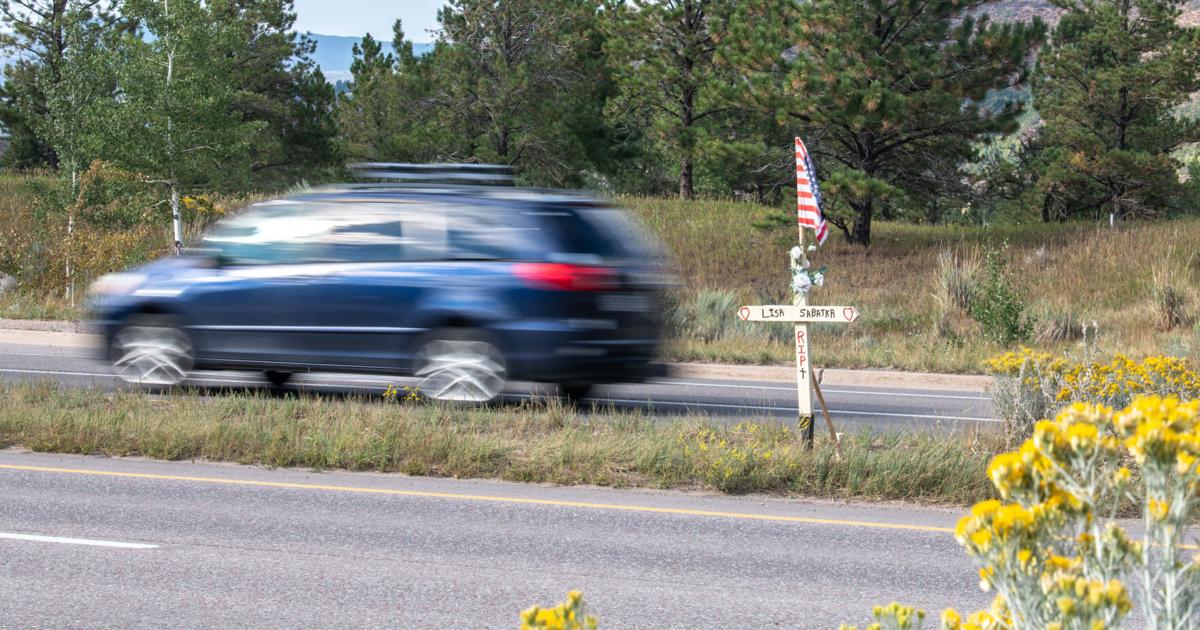 A roadside marker near the Aspen Country Inn honors Lisa Sabatka, who was struck and killed by a vehicle last December. 