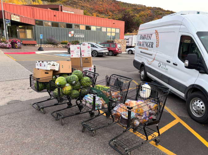 Harvest for Hunger, a food rescue service in the Roaring Fork Valley, provides food for families who cannot put food on their table each night. Shopping carts of donated food are being unloaded, soon to be moved to the Harvest for Hunger stigma-free pantry. 