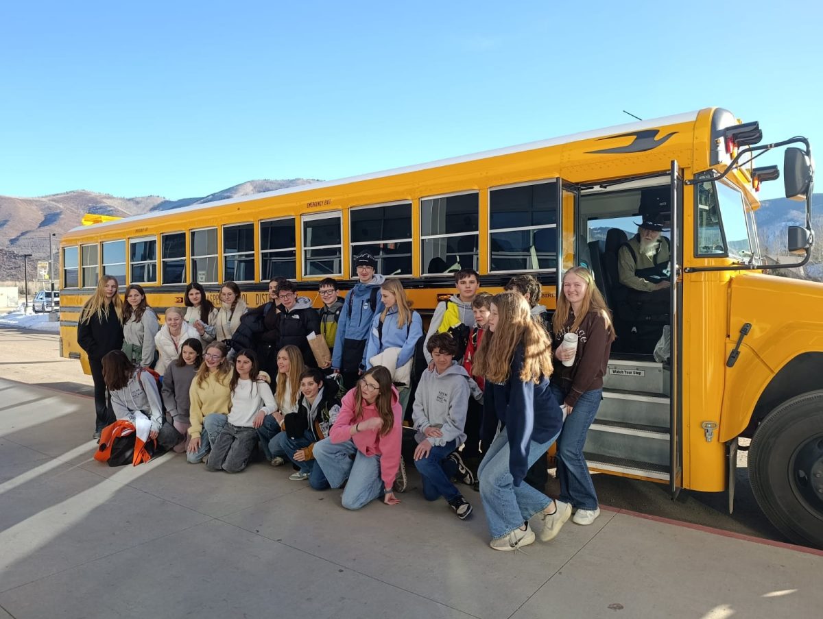 Aspen Sister Cities students from Chamonix and Aspen pose in front of the school bus before the Chamonix students depart back to France.
