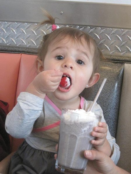 A young Allessa enjoys a milkshake at Boogie’s Diner, a former local restaurant in Aspen.