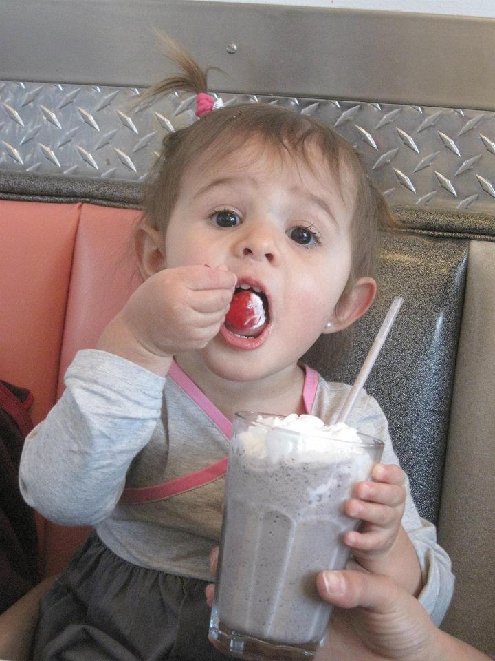 A young Allessa enjoys a milkshake at Boogie’s Diner, a former local restaurant in Aspen.
